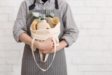 Unrecognizable woman holding Eco friendly products for home cleaning. Natural domestic cleaning, zero waste detergent