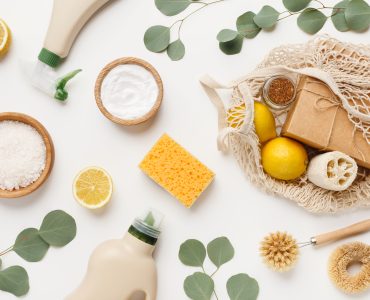 Eco friendly natural cleaners, cleaning products, chemical detergent bottles, flat lay on white background